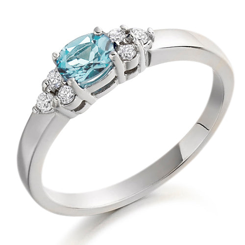 This Aquamarine & Diamond Trefoil Ring showcases a beautiful aquamarine that adds a touch of regal elegance to any outfit.