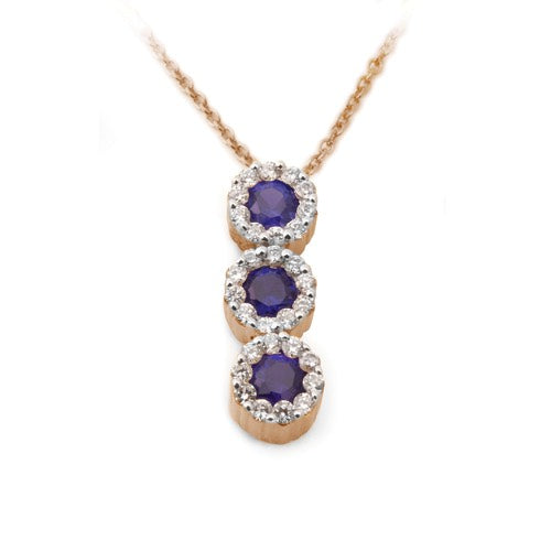 A Blue Sapphire Diamond Halo Journey Pendant with a vertical line of round blue sapphires encircled by diamond halos on a white background.
