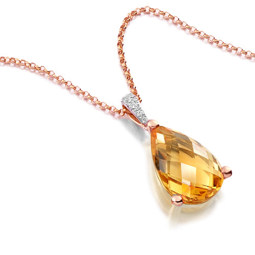 This Citrine Pear Pendant features a faceted pear-shaped citrine stone in a delicate three-claw setting. Adorned with a sparkly diamond bail.