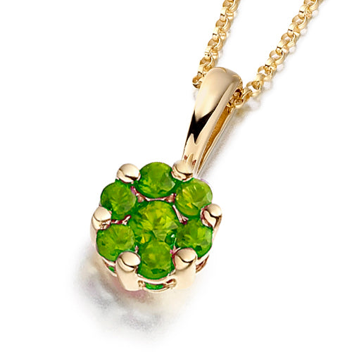 A floral-inspired cluster pendant featuring vivid green emeralds.