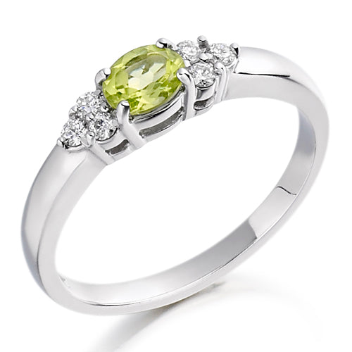 The lively peridot, symbolising renewal and energy, is flanked by two glittering diamonds in a timeless trefoil setting—perfect for those who embrace colour with grace.