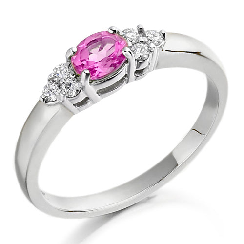 With its soft blush tones, the pink topaz is perfectly complemented by two brilliant diamonds in a classic trefoil design, creating a ring that’s both romantic and radiant.