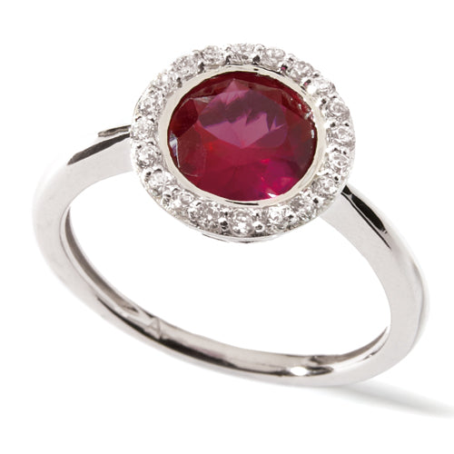 A beautiful ring with a central ruby surrounded by a halo of smaller diamonds.