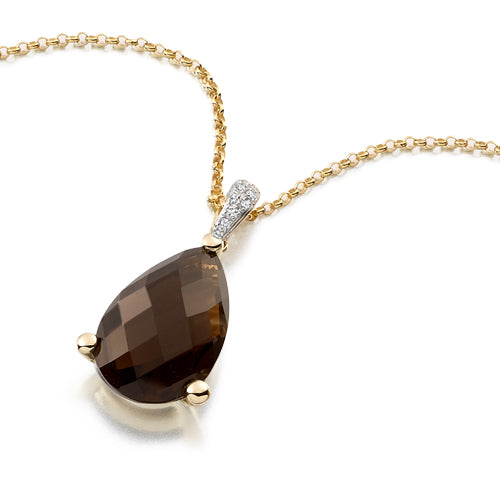 A smoky quartz pear pendant with a gold chain, featuring a faceted pear-shaped smoky quartz stone in a delicate three claw setting with a sparkly diamond bail.
