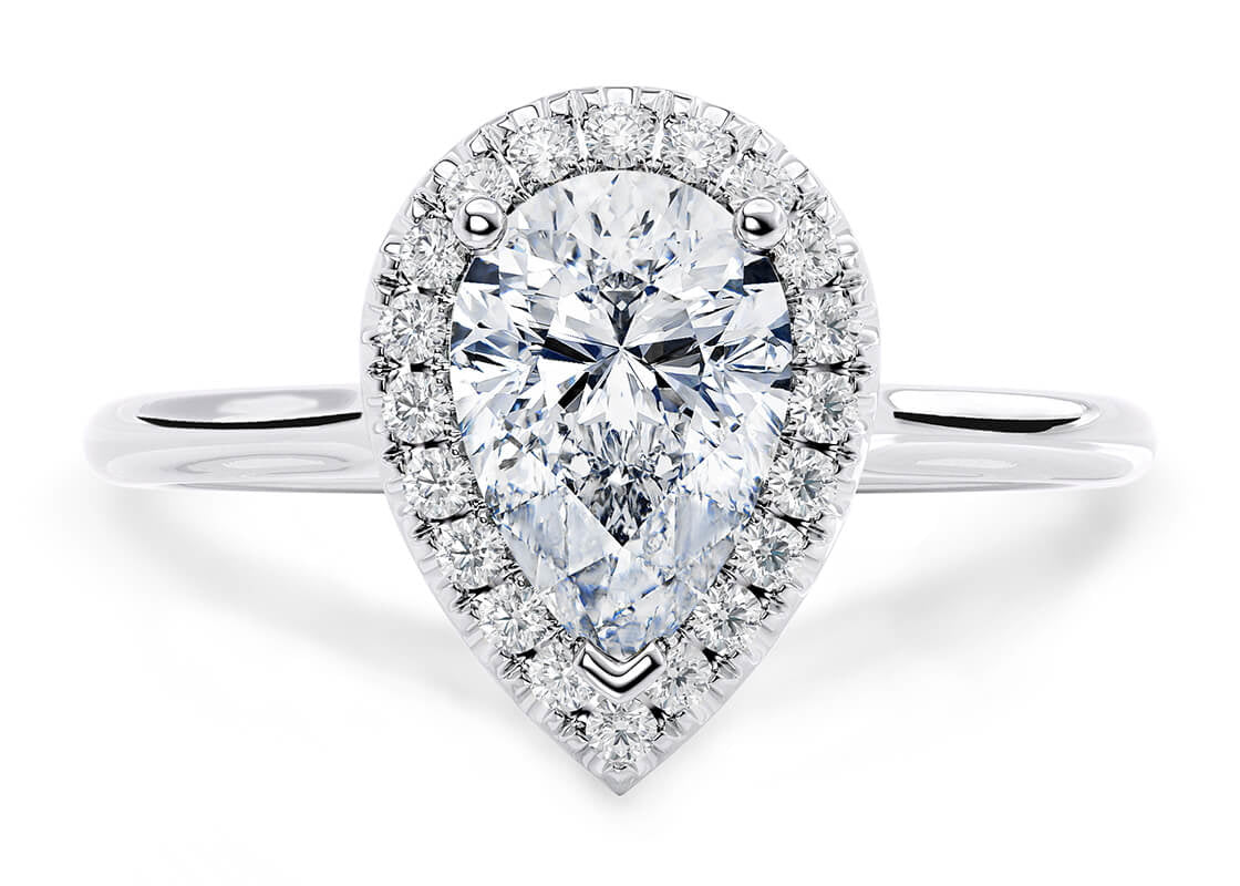 A beautiful GIA certified pear cut halo diamond engagement ring, with a 0.90ct centre diamond of E colour and VS1 clarity. Surrounding halo diamonds weigh approximately 0.15ct. Diamonds set in an 18ct white gold mount.