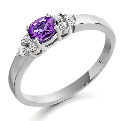 This Amethyst &amp; Diamond Trefoil Ring showcases a beautiful purple amethyst that adds a touch of regal elegance to any outfit. With its stunning colour and timeless design, it is the perfect way to add a pop of colour to your jewellery collection. Own a royal gem that exudes luxury and sophistication.