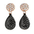 Expertly crafted with stunning black diamonds and a sparkling diamond cluster, these elegant earrings are a must-have for any jewelry collection.
