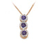 A Blue Sapphire Diamond Halo Journey Pendant with a vertical line of round blue sapphires encircled by diamond halos on a white background.