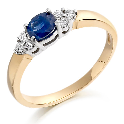 This Round Blue Sapphire &amp; Diamond Accent Ring showcases a beautiful, deep blue sapphire that adds a touch of regal elegance to any outfit. 