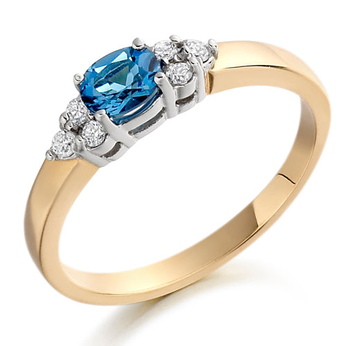 This Blue Topaz &amp; Diamond Trefoil Ring showcases a beautiful London blue topaz that adds a touch of regal elegance to any outfit.