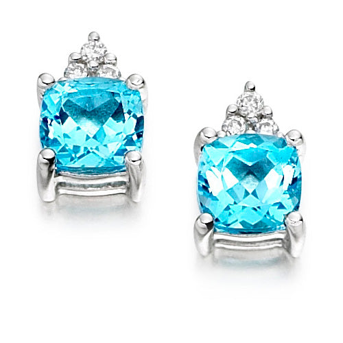 These luminous Blue Topaz Trefoil Earrings is designed with brilliant blue topaz gemstones in a graceful three-stone trefoil arrangement.