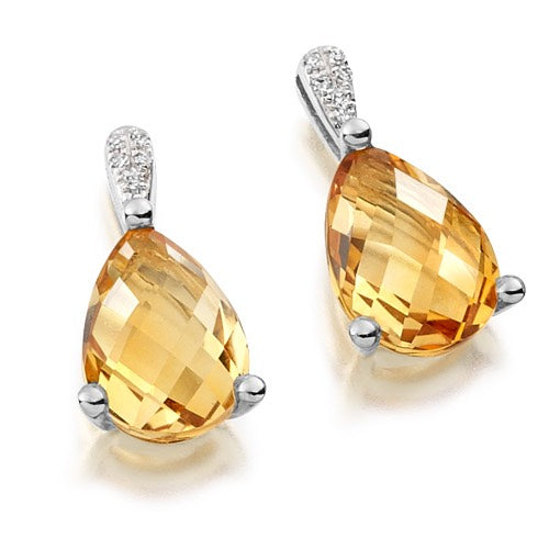 Expertly crafted, these Citrine &amp; Diamond Drop Earrings feature faceted citrine stones in a pear shape, held by a sparkling diamond bail.