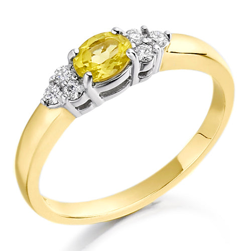 Designed with a warm, radiant citrine at its centre and flanked by two shimmering diamonds, this trefoil setting evokes grace and sophistication.