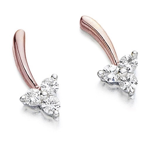 A pair of leaf-shaped stud earrings crafted in rose gold.