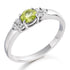 The lively peridot, symbolising renewal and energy, is flanked by two glittering diamonds in a timeless trefoil setting—perfect for those who embrace colour with grace.