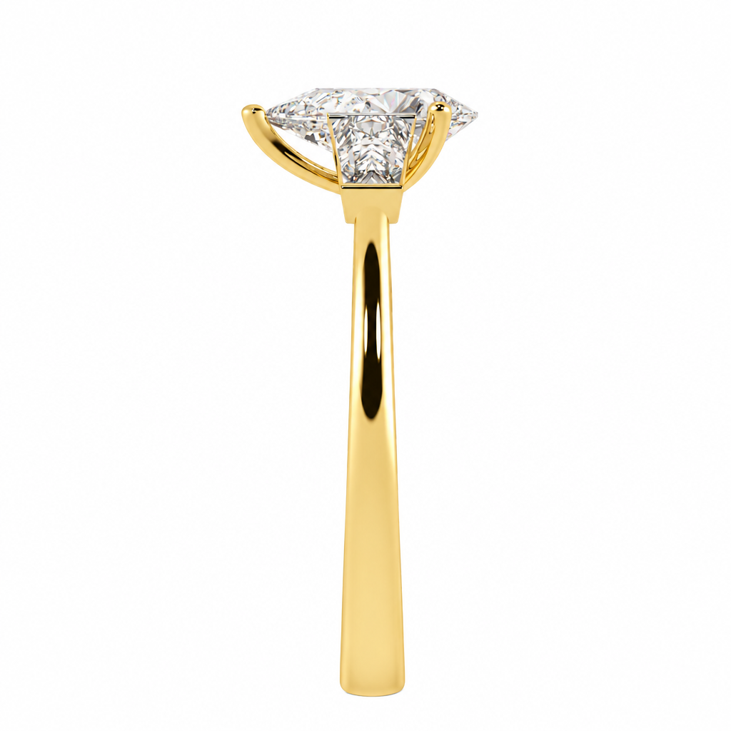 Pear &amp; Baguette Three Stone Ring in yellow gold, side view