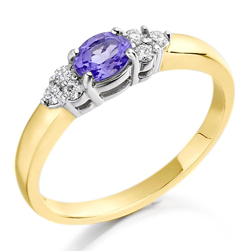 Set in a charming trefoil design, three brilliant stones one central tanzanite flanked by sparkling diamonds create a graceful balance of colour and light.