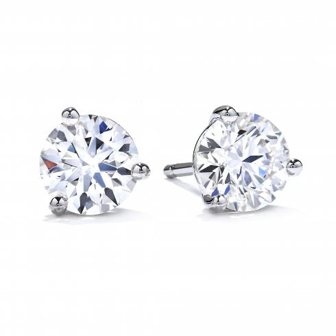 A pair of three claw solitaire earrings with round diamonds set in white gold.